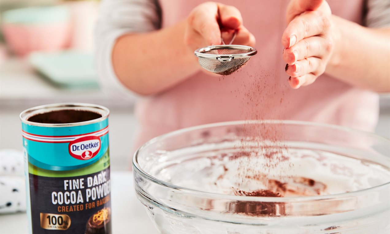 Picture - Adding Cocoa Powder to meringue